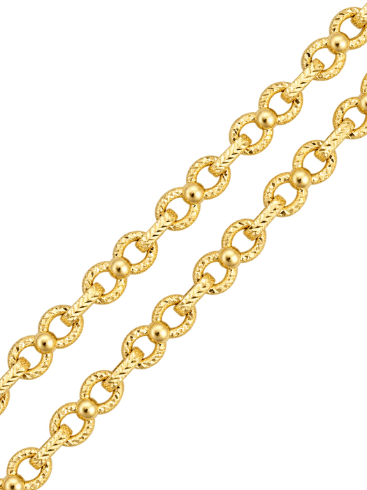 Close-up of diamond-cut infinity links in yellow gold on transparent background