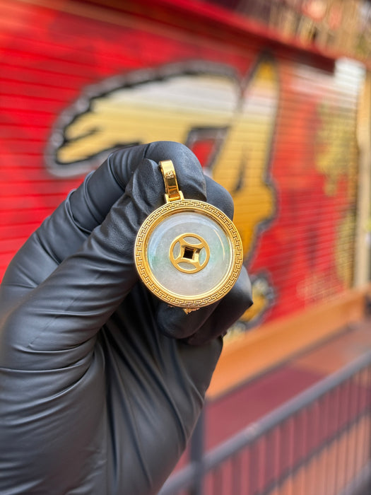Original reverse photo of the koi and lotus jade pendant held in a black glove