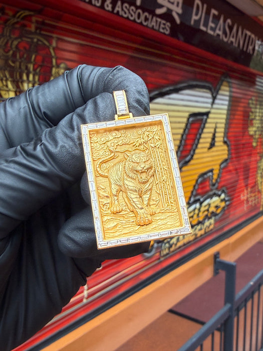 Original photograph of the 18K tiger and bamboo diamond pendant